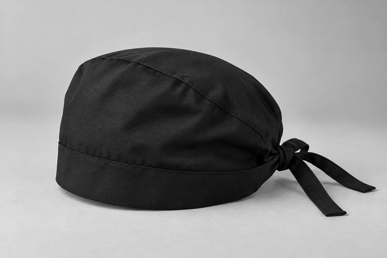 Black scrub cap with Medrique branding