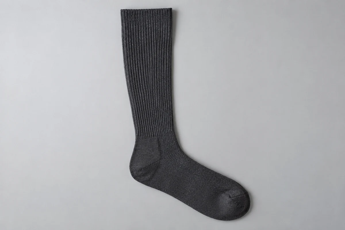 Charcoal knee-high sock sample with detailed calf knit